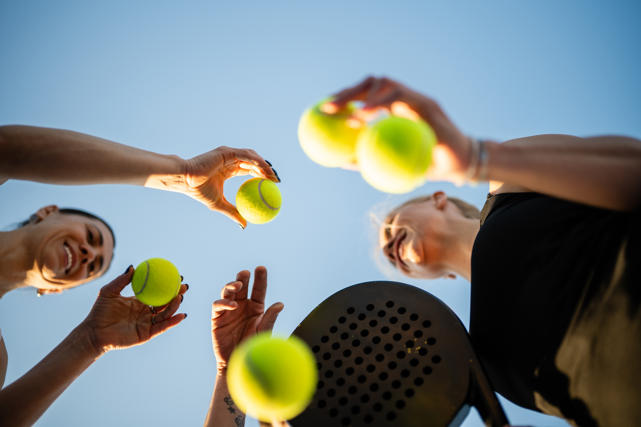 Padel balls and racquets ready for a club night